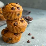 Close-up of Chocolate Chip Pumpkin Muffins on a gray surface