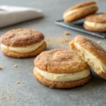 Cheesecake stuffed snickerdoodle cookies with cinnamon sugar coating