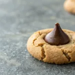 Chewy peanut butter cookie topped with a chocolate Kiss