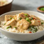 Creamy Cajun chicken and rice with peas on gray background