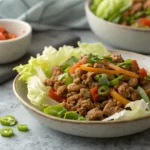 Ground turkey and vegetable skillet over shredded lettuce