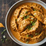 Baked Thai curry dumplings in creamy coconut sauce
